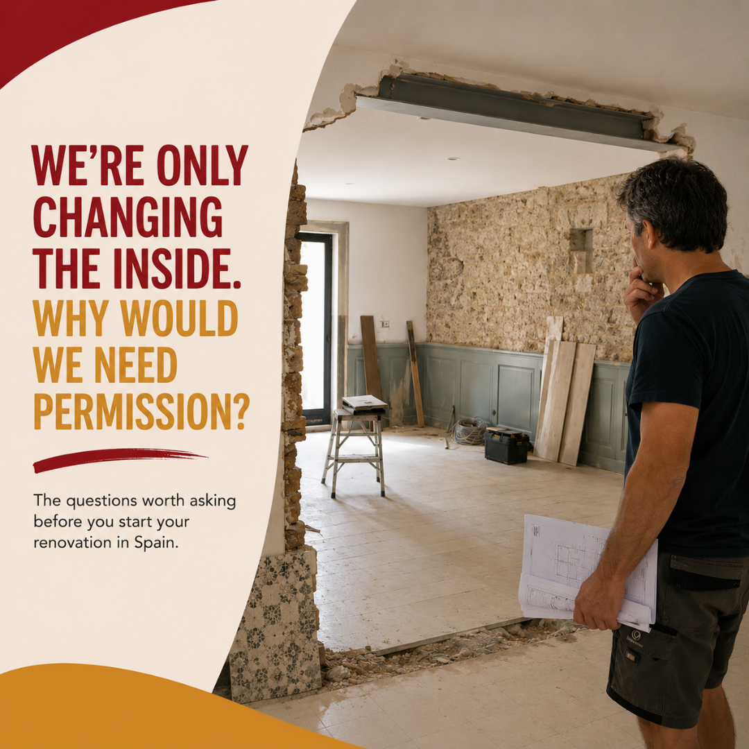 Homeowner reviewing renovation plans inside a Spanish property while internal building work is underway.